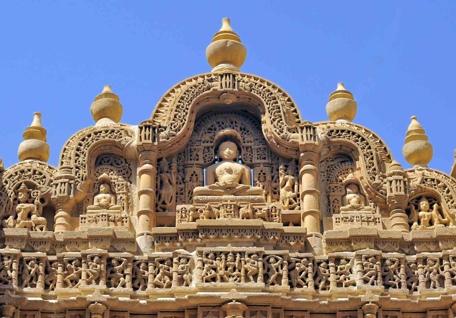 Intricate stone carvings of a Jain Derasar temple illustrating the Shastras and the physics of form.